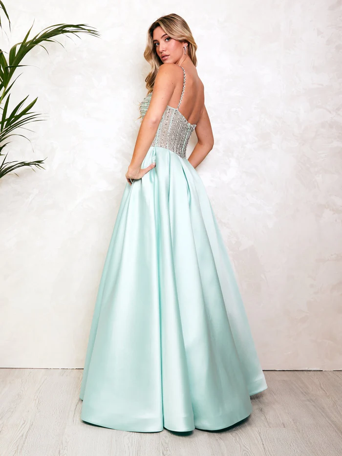 A customer in a sage-mint ballgown, shared on TikTok